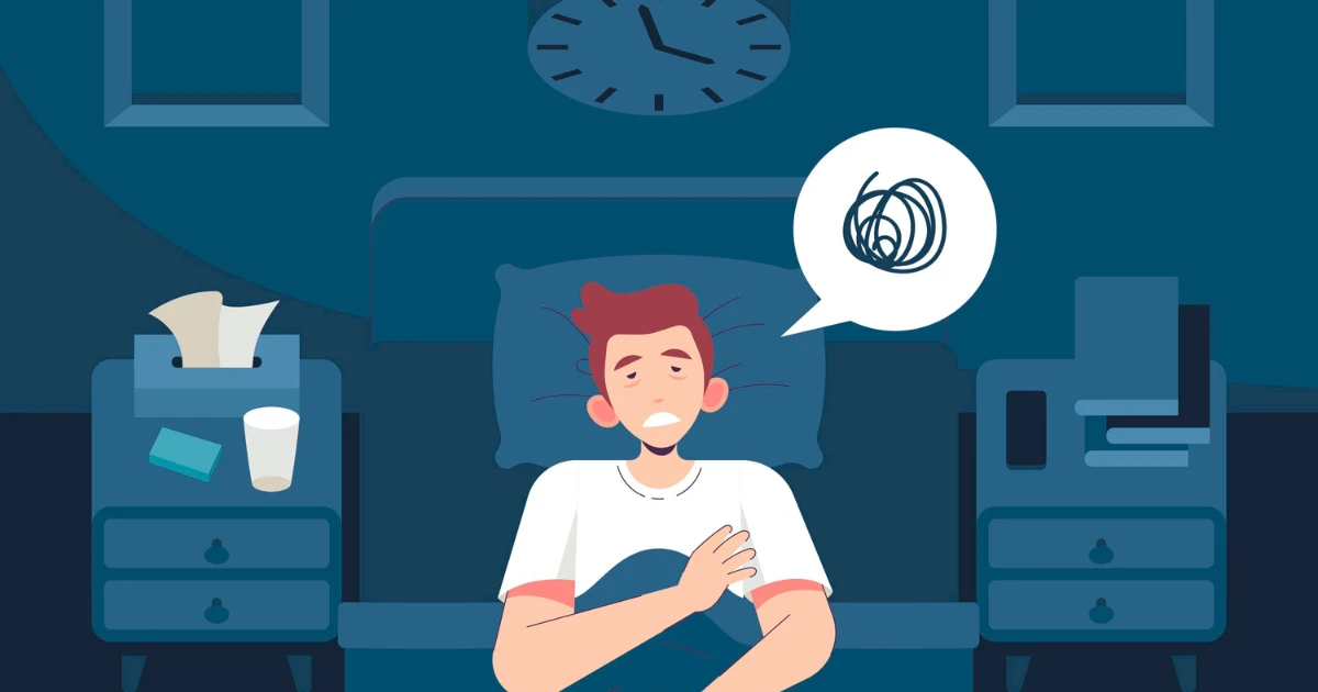 Illustration of a person lying awake in bed at night, looking anxious and restless, symbolizing symptoms of a behavior disorder.