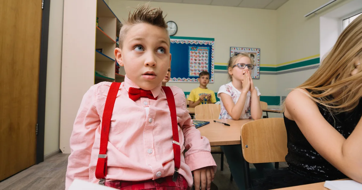 Children in a classroom learning about Tic Awareness and inclusion among students.