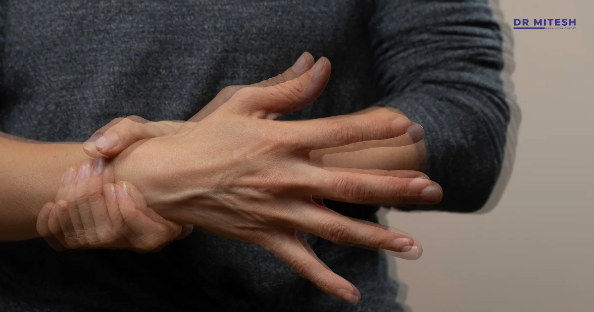 Person holding their hand with visible shaking, representing drug-induced tremors.